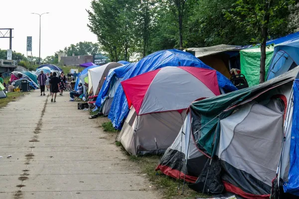  Dozens of tents are crammed into a patch of grass near East Franklin and Hiawatha avenues in south Minneapolis on Wednesday. Mark Zdechlik | MPR News 